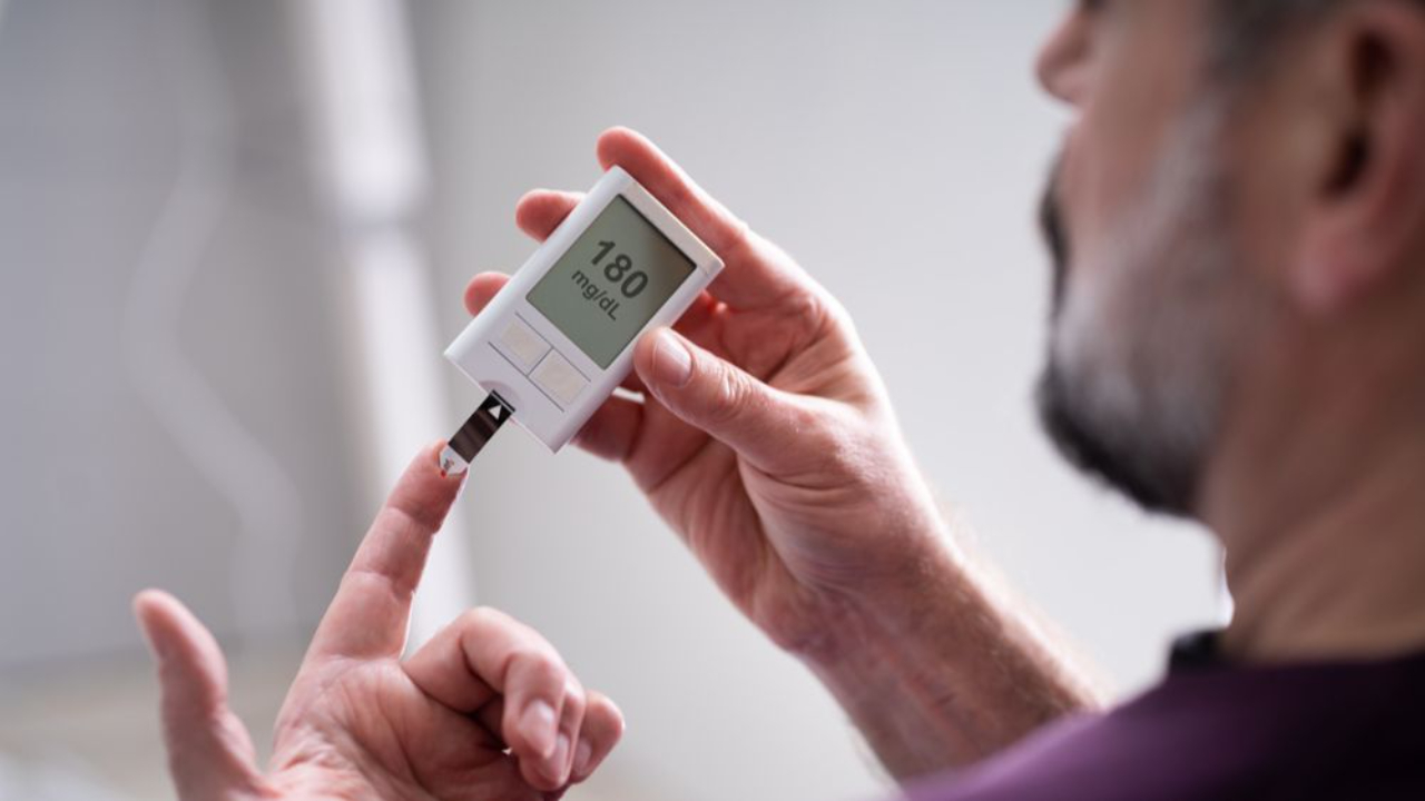 Man checking blood sugar