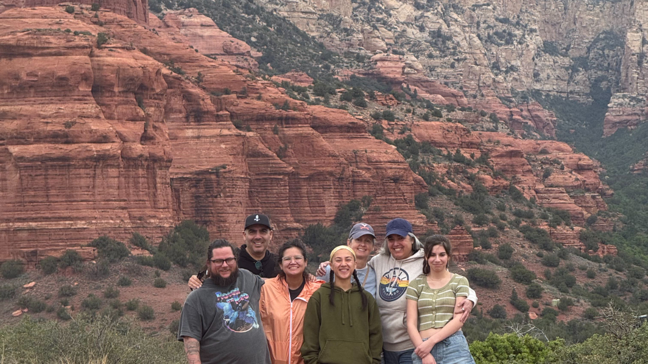 Family on vacation in front of Sedona red rocks