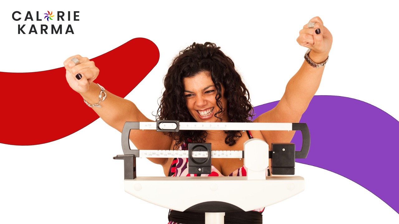 Woman celebrating weight loss success during perimenopause Calorie Karma