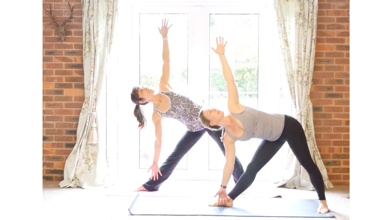 two women practicing barre-less barre