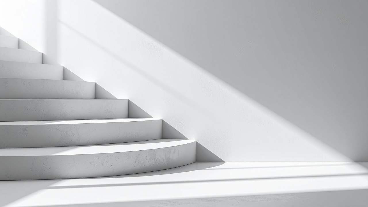 Minimal concrete staircase with light and shadow symbolizing structured leadership and life progression