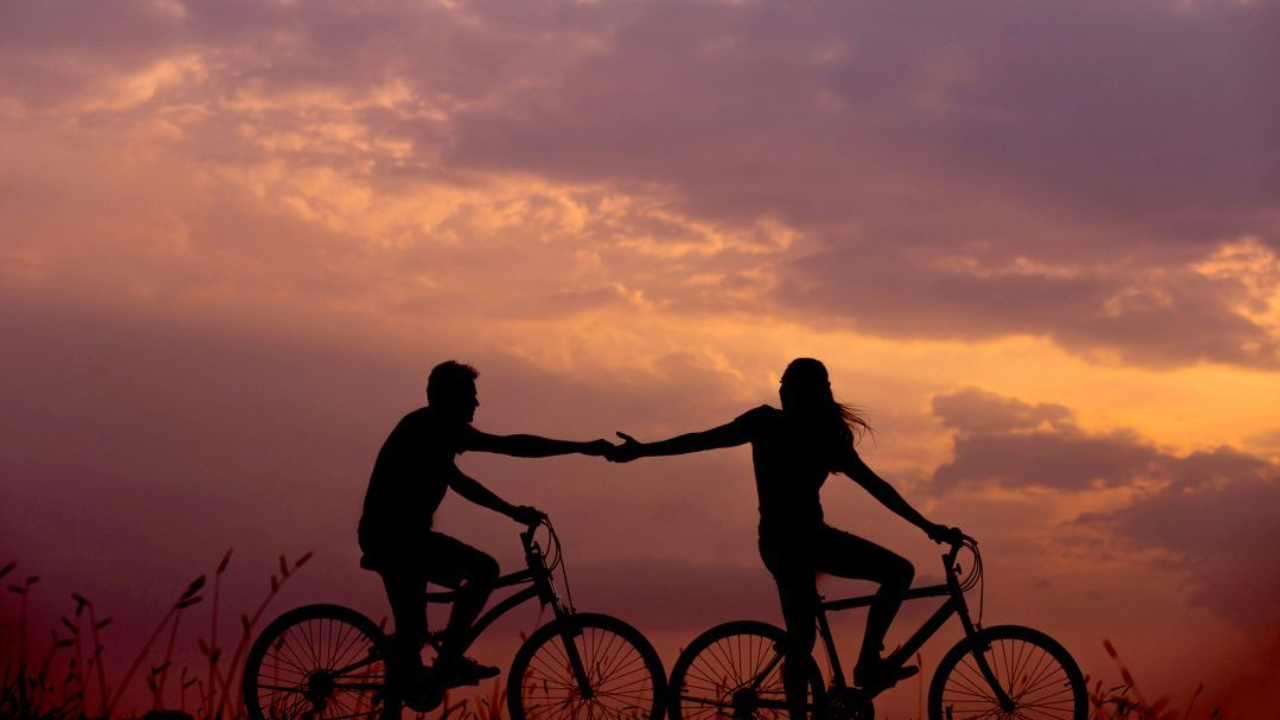 Couple riding bikes