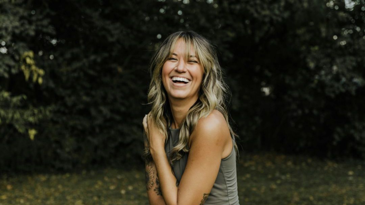 Woman outdoors happy and smiling
