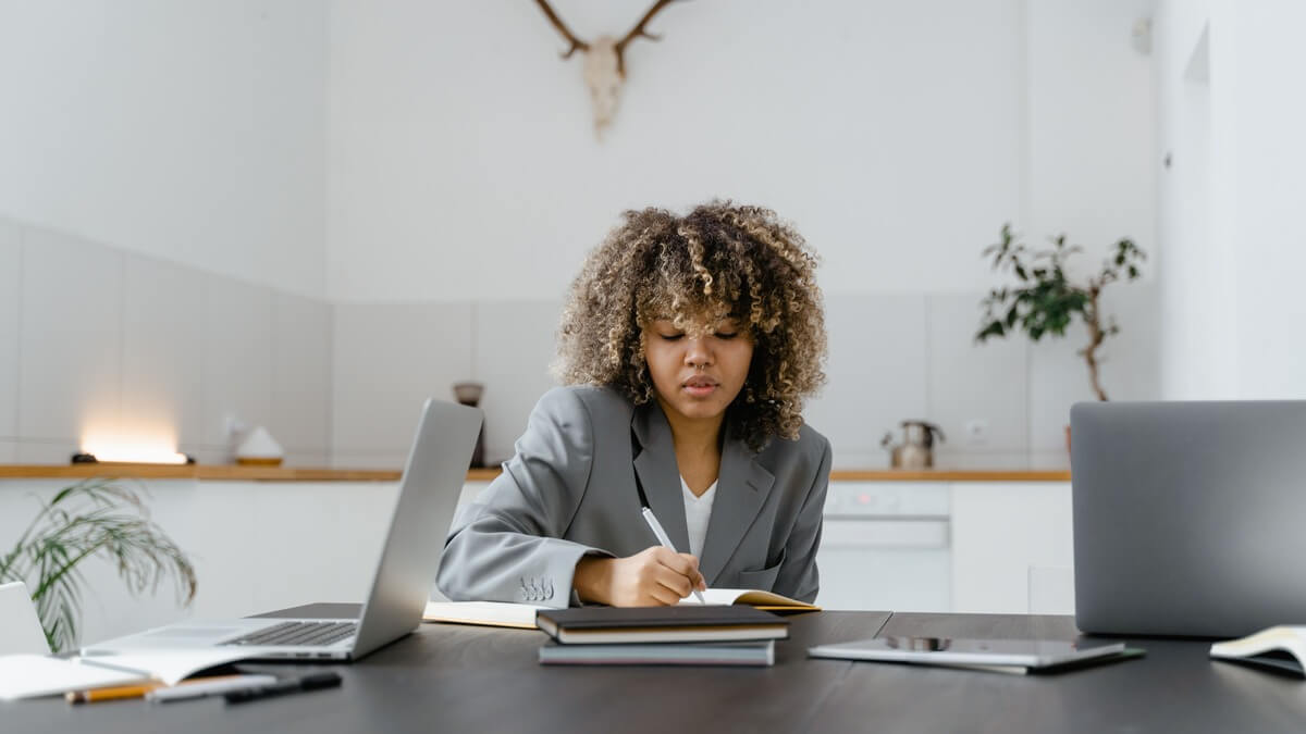 a woman in professional outfit in an office