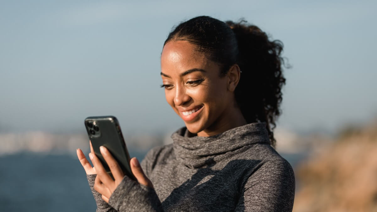 a woman looking at a mobile phone