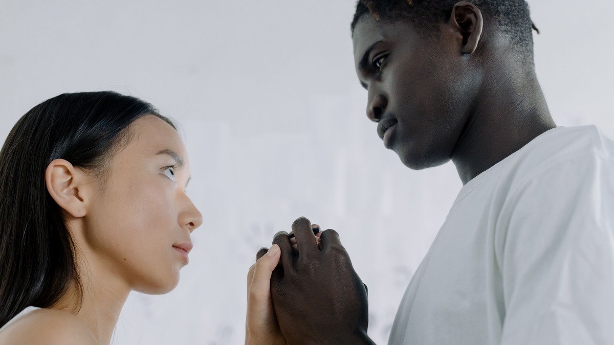 Couple facing each other during a serious conversation about their relationship