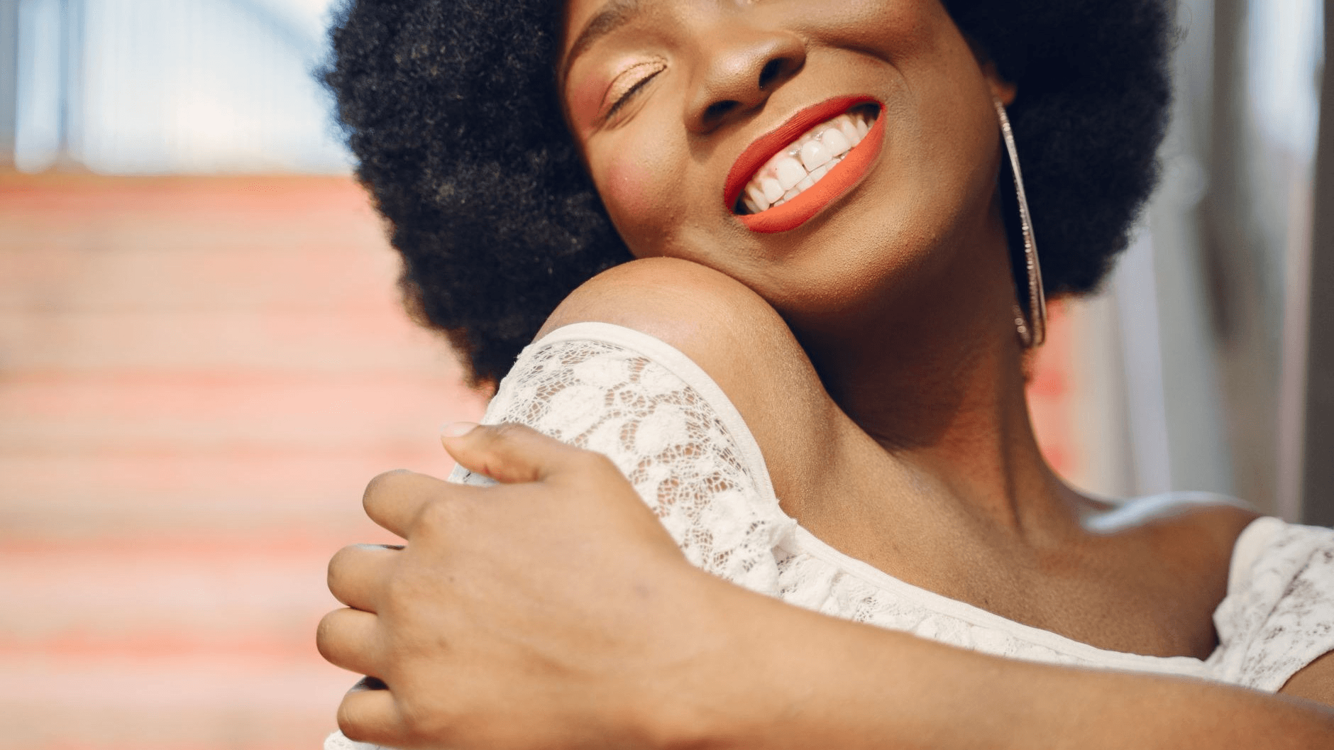 a woman happily embracing herself
