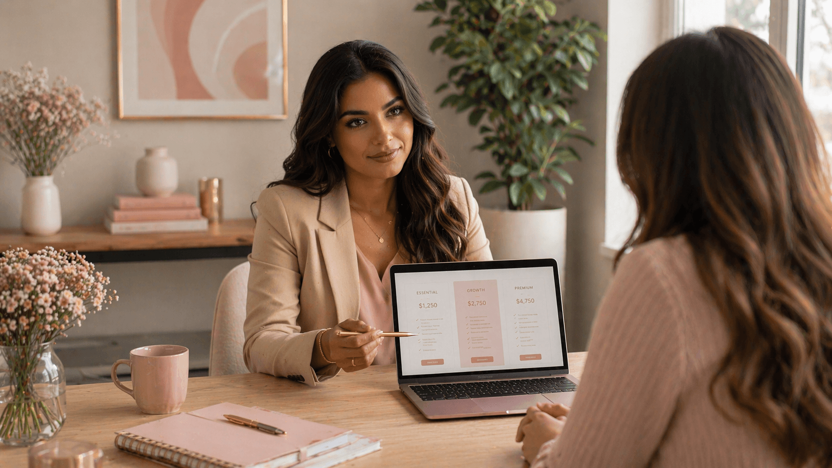 a woman showing pricing tiers in her laptop to another woman