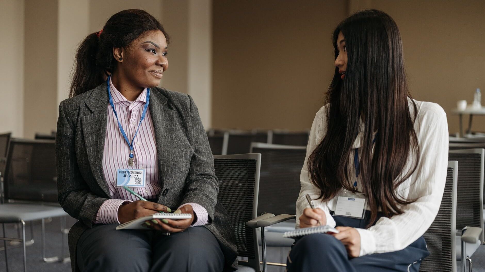 two women talking side by side