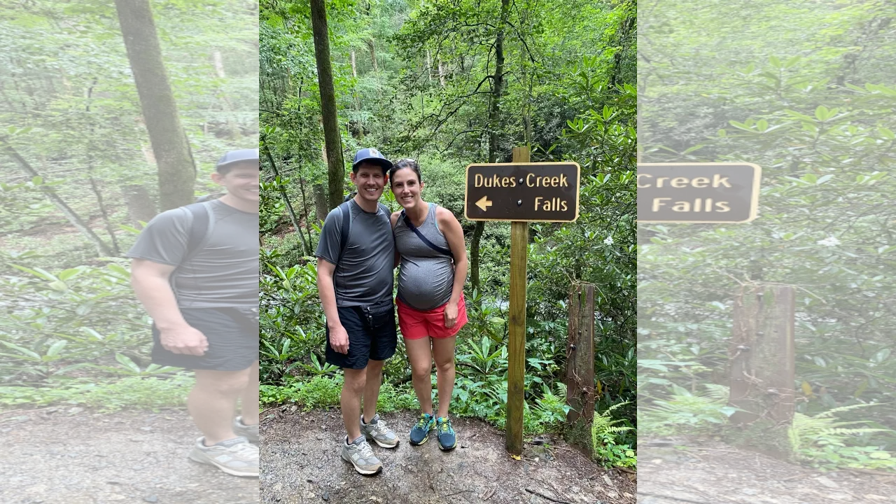 Young couple on a hike before baby arrives