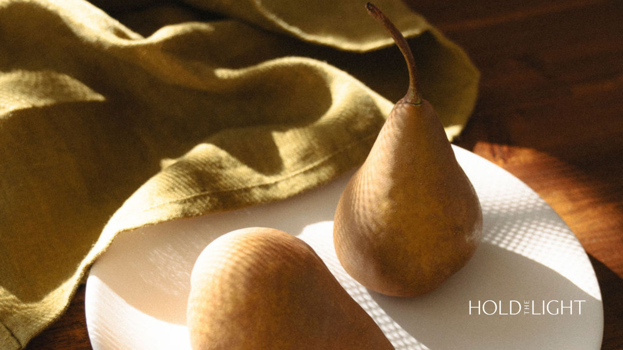 Pears on a plate in shadow and light