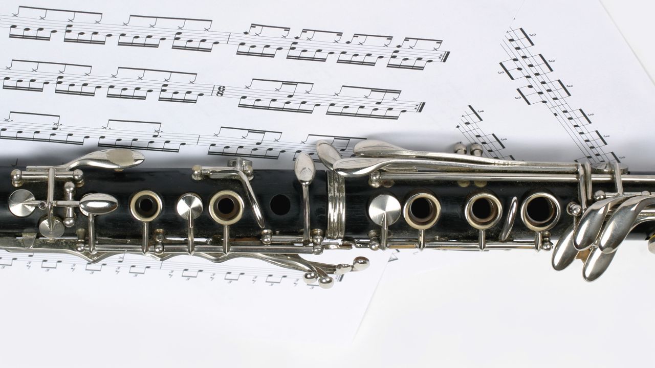 Clarinet on a background of a musical score