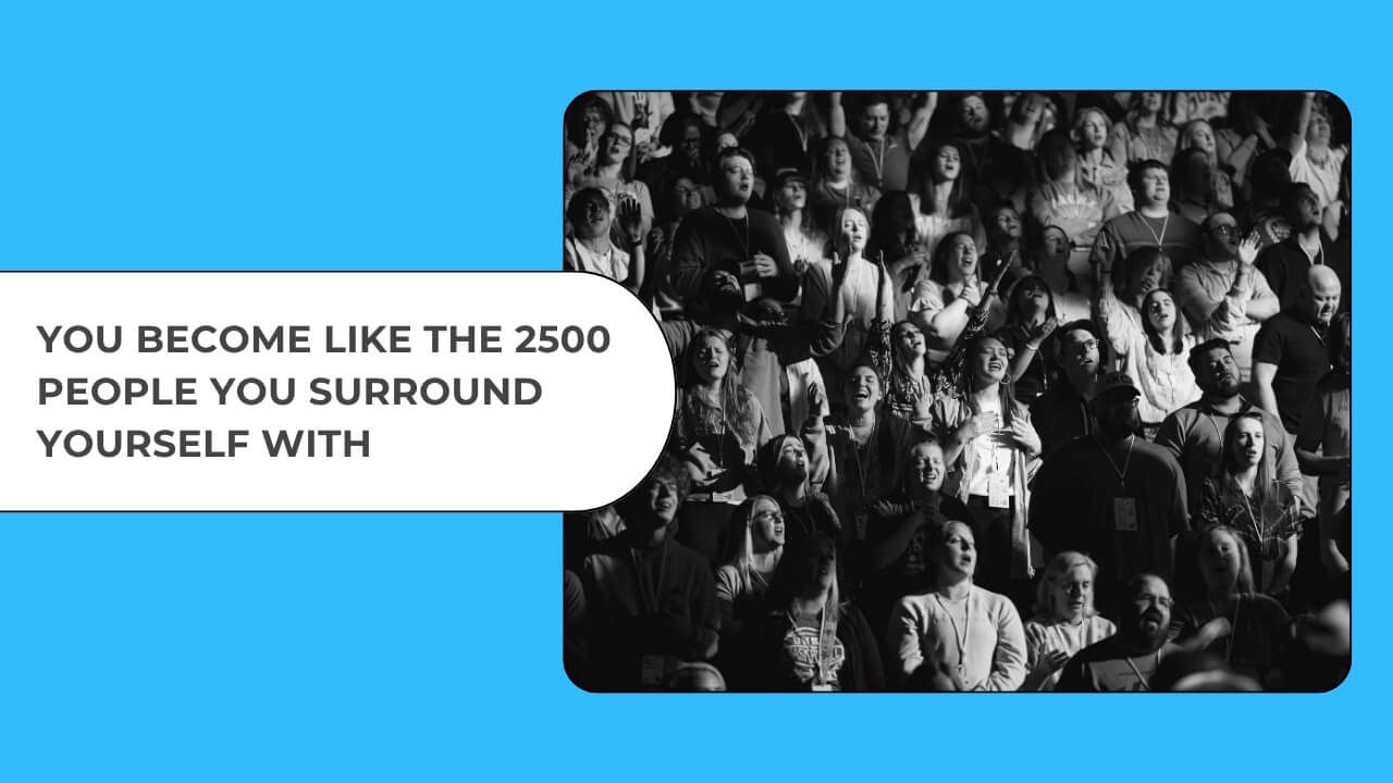 Large crowd singing together symbolising human connection, shared energy, and the power of collective joy.