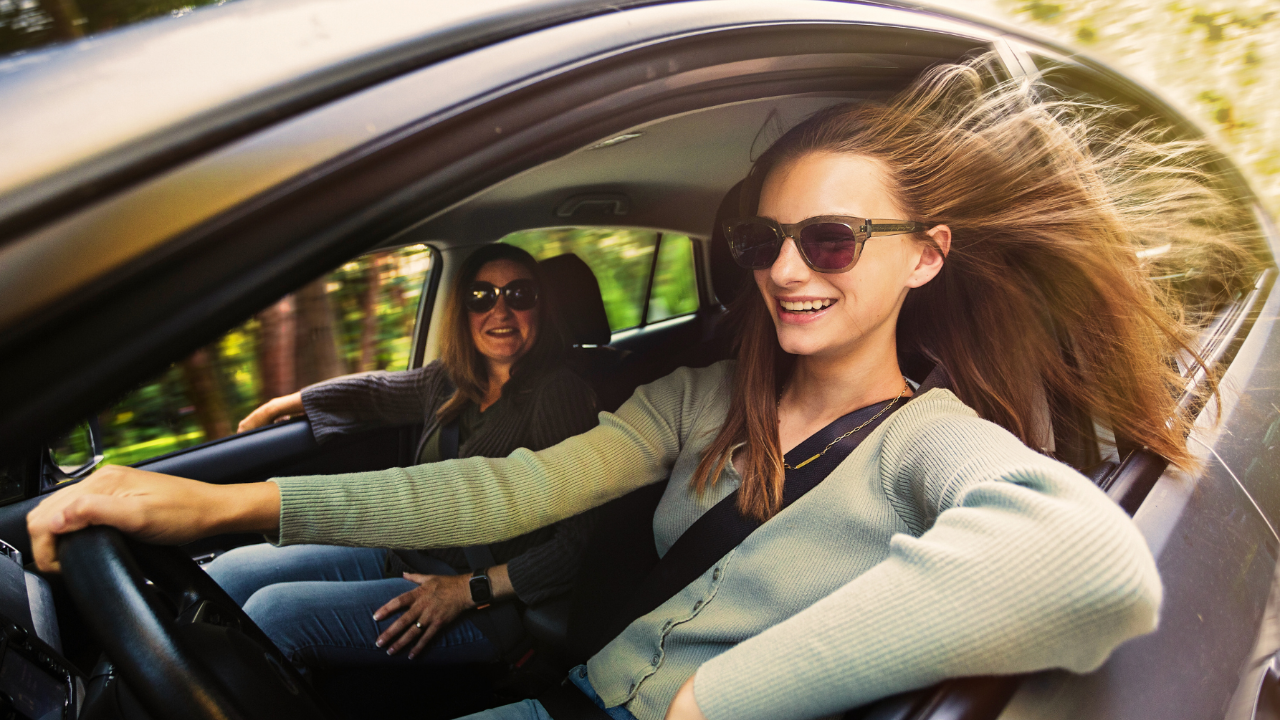 Parent and Teen Smiling Together – A connected and happy moment between a parent and their teenager.