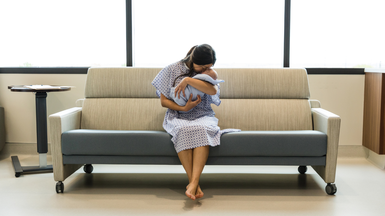 New mother and baby in calm setting representing birth trauma healing.