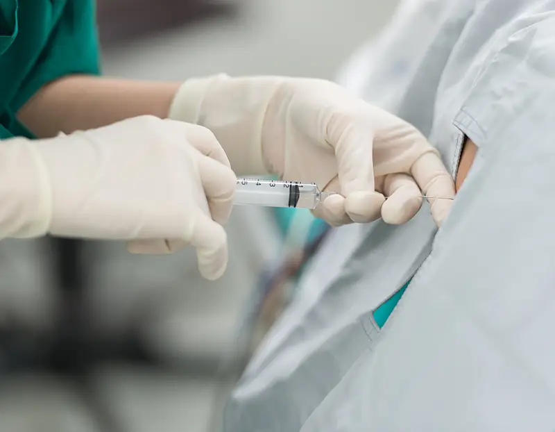 Hospital staff administering spinal anaesthetics