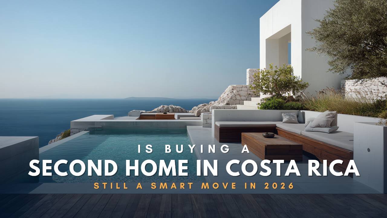 Buying a second home in Costa Rica 2026. Modern luxury real estate with white stone architecture, outdoor lounge, and infinity pool overlooking the sea.