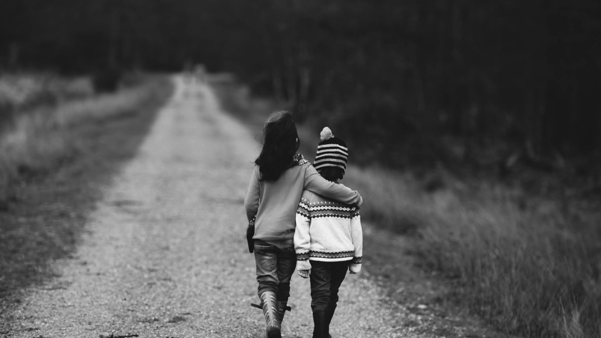 Children on dirt road, supported