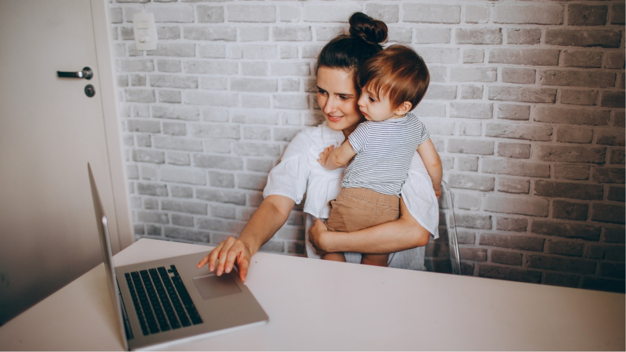 Woman working from home with child as a virtual assistant