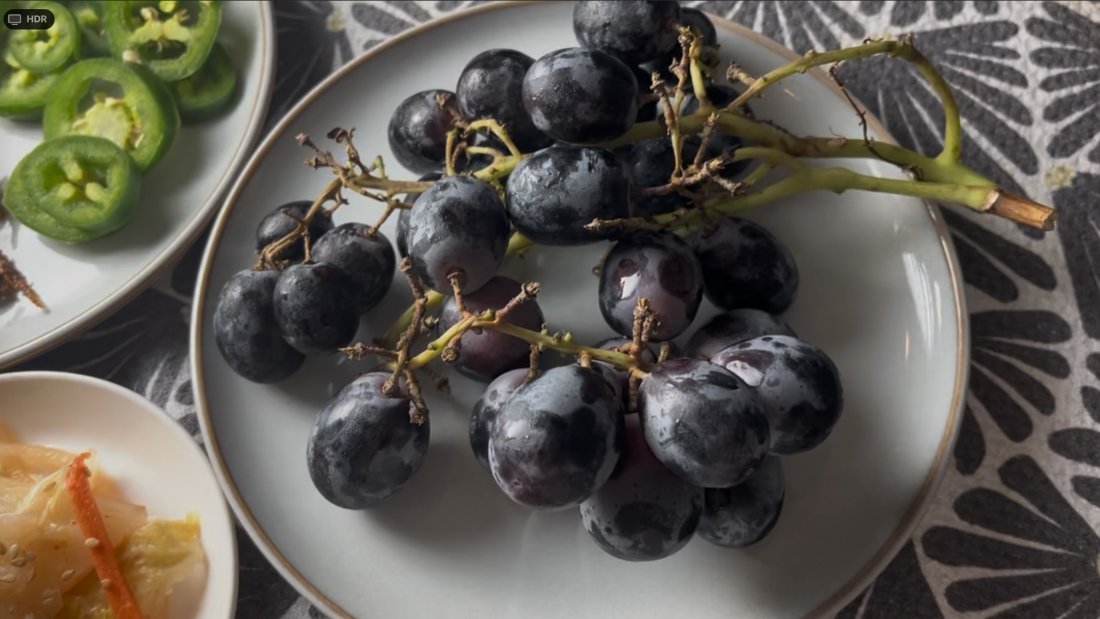 Dark grapes on a plate for dessert