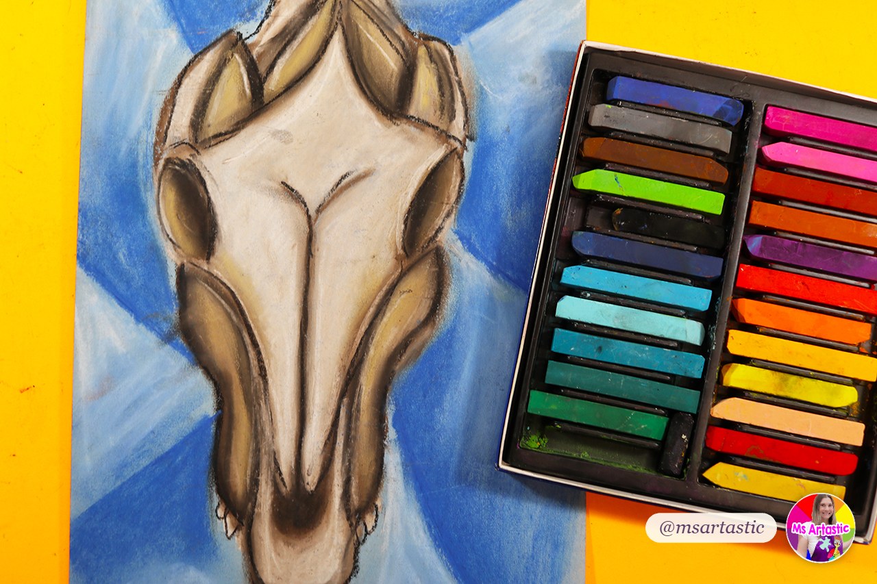 Georgia O'Keeffe inspired cow skull artwork showing the principle of design emphasis, with chalk pastels