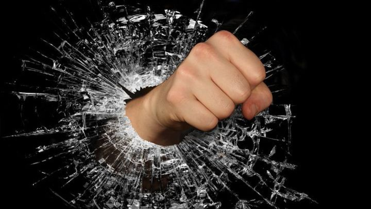 fist punching through glass