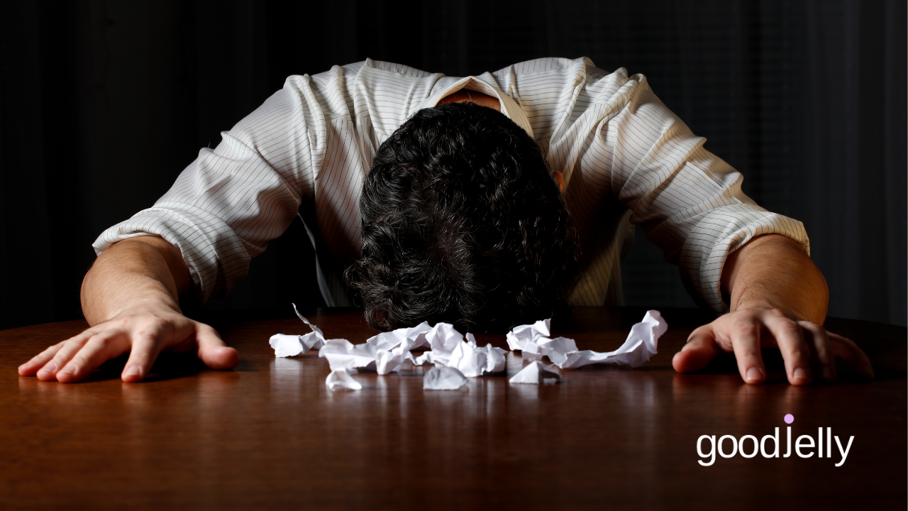 frustrated-man-head-on-table