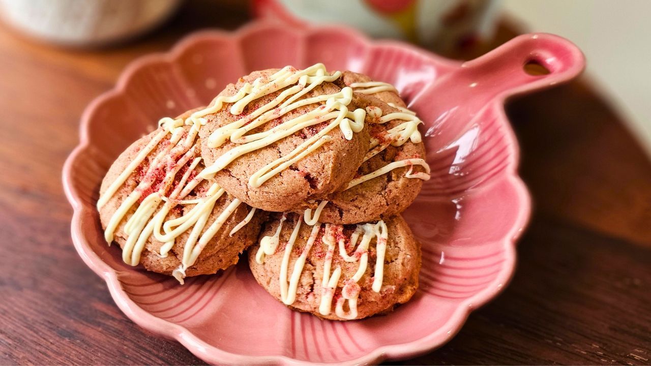 3 Strawberry and White chocolate snickerdoodle cookies sitting on a pink plate 