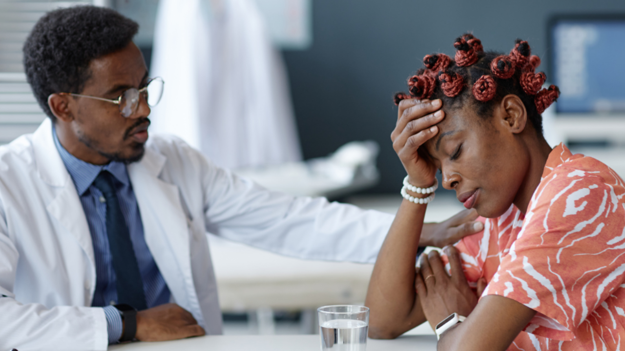 woman asking questions to her doctor during menopause checkup