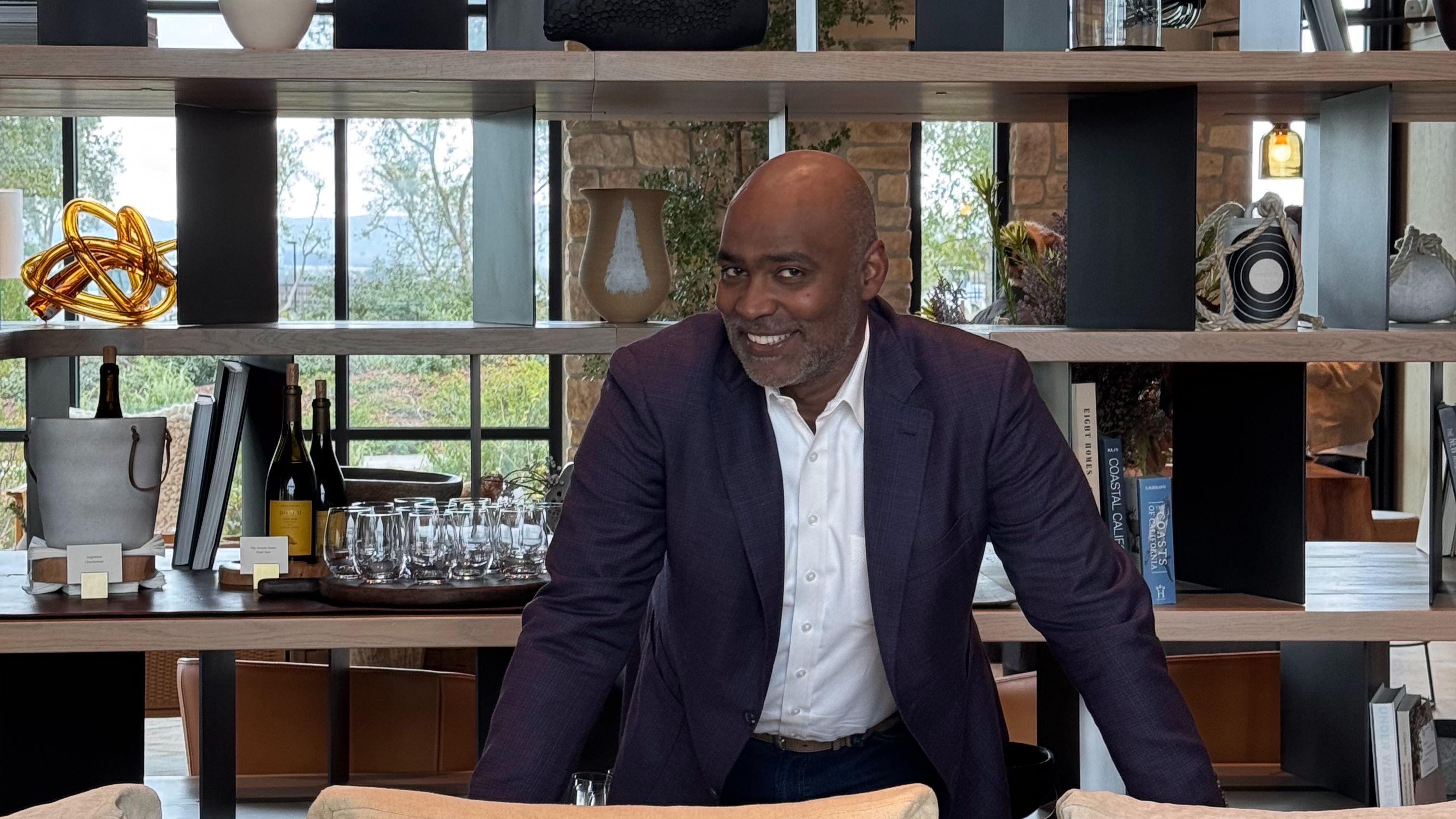 Ivan standing behind a sofa in a resort lobby