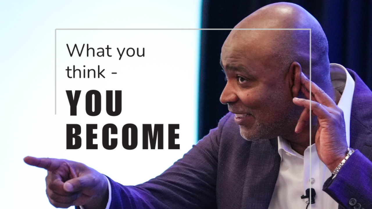 Ivan on stage listening and pointing to an audience member