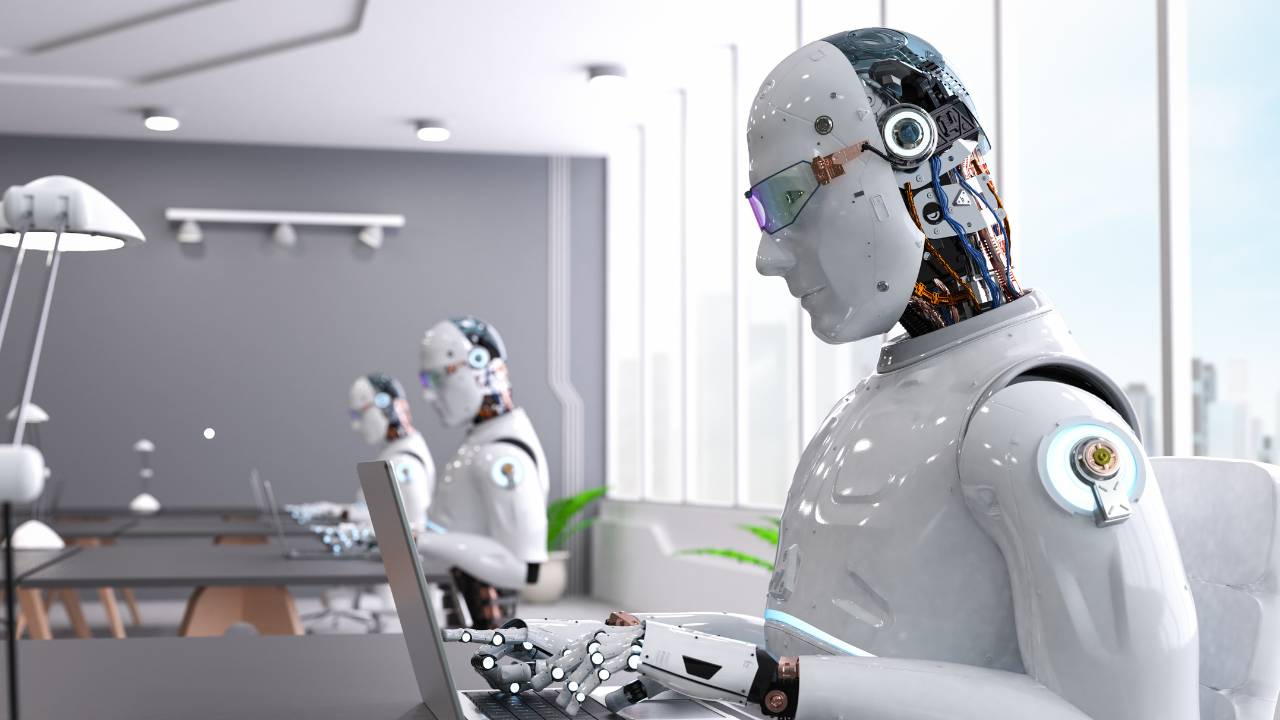 Virginia Stockwell, Kajabi consultant, working at a desk