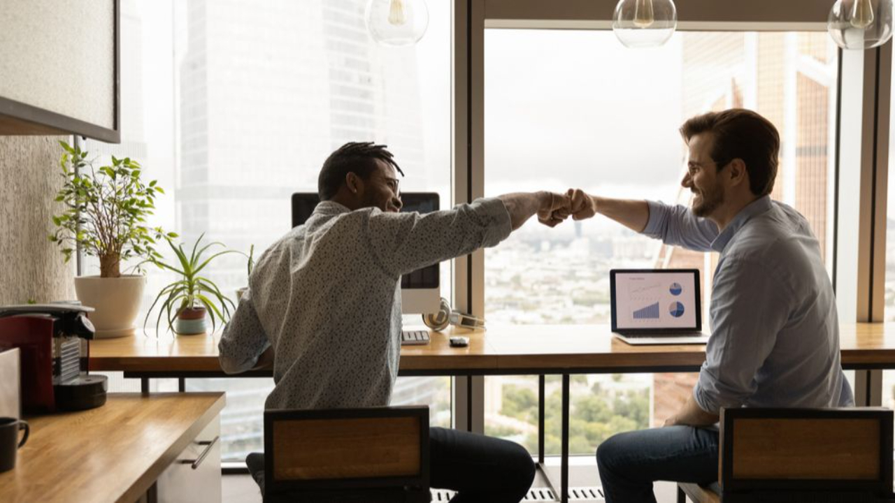 coworkers-fist-bump