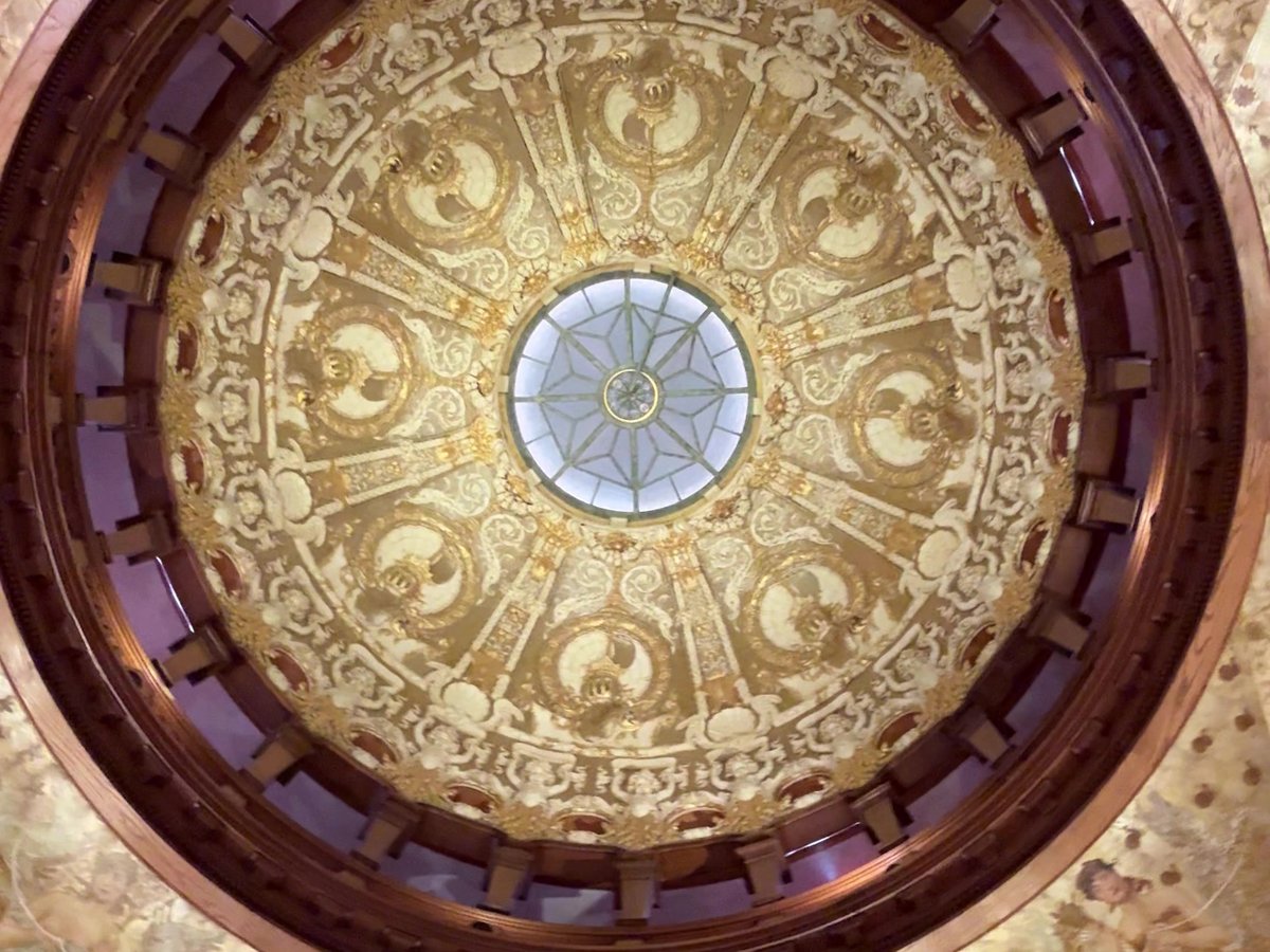 Ornate gold dome and skylight in the Flagler College rotunda, St. Augustine