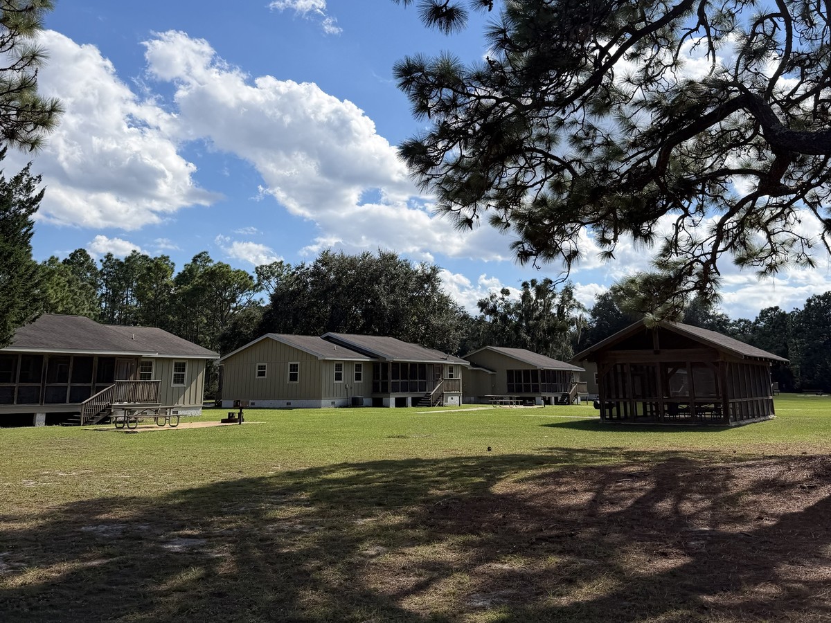 Cabins with screened porches and a picnic pavilion at Crooked River State Park