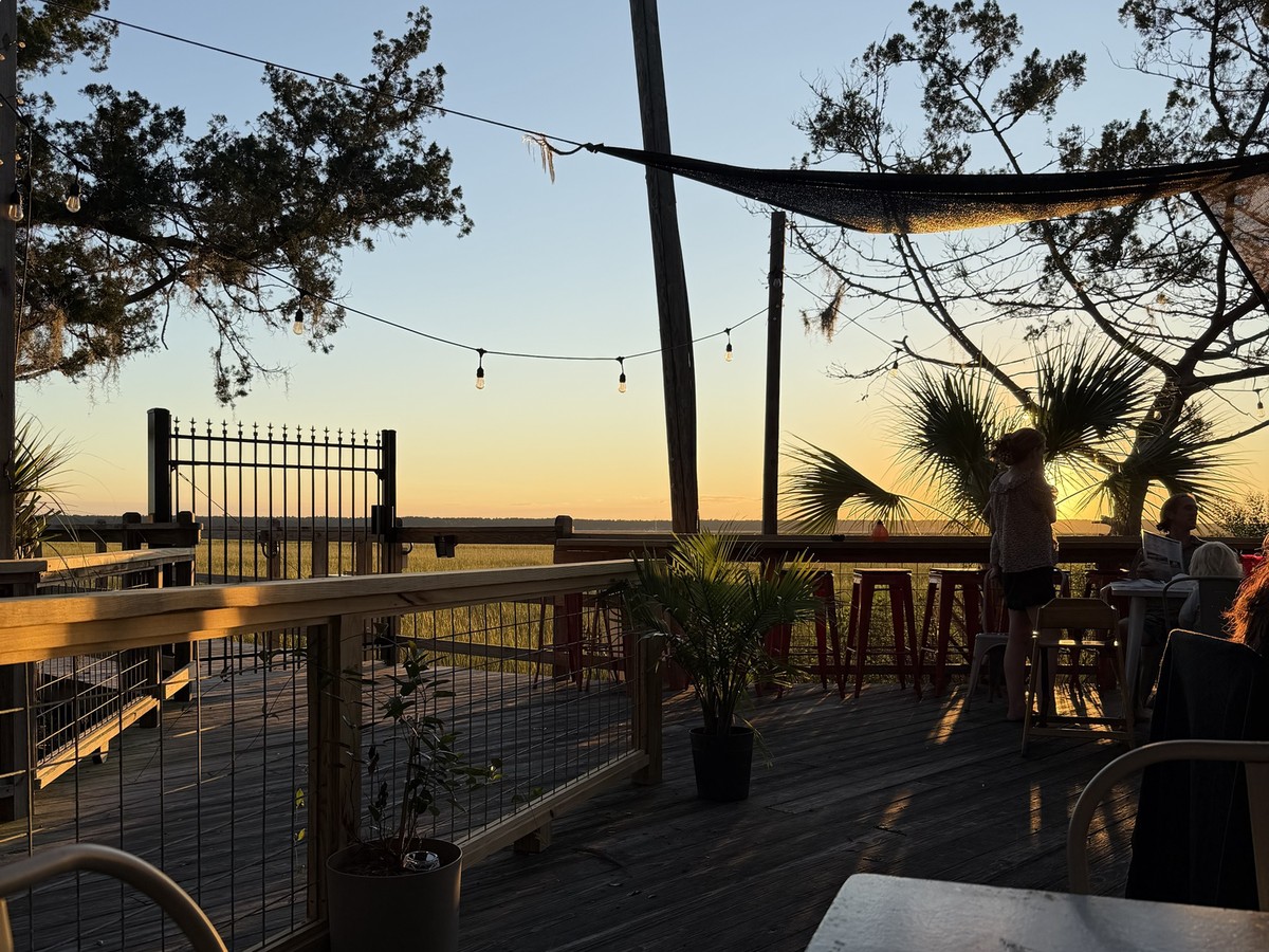 Locals Dockside patio overlooking the marsh at golden hour in St. Marys, Georgia