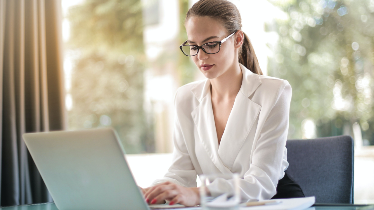 Businesswoman working on a laptop creating social media content