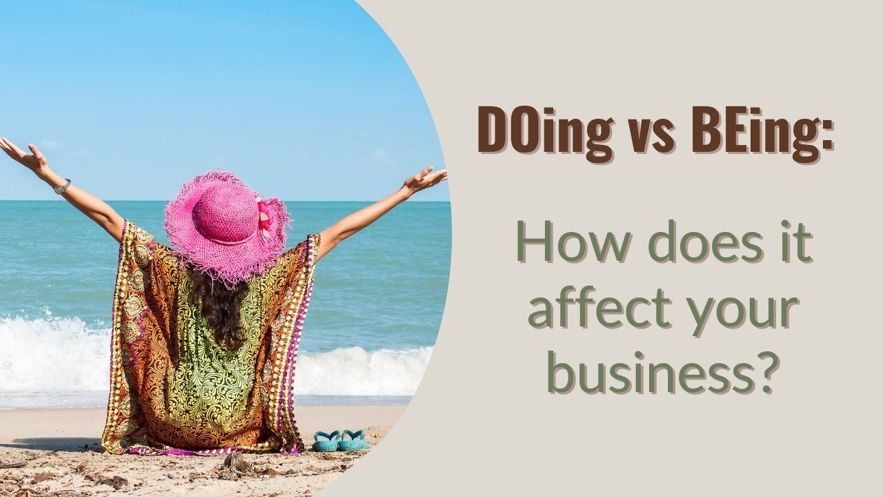 DOing vs BEing How does it affect your business - woman with pink brim hat raised hand at the beach