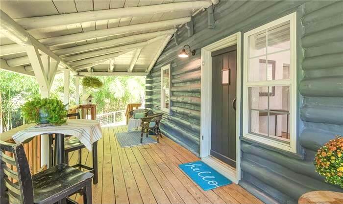 exterior of a cabin vacation rental as seen from the large front porch