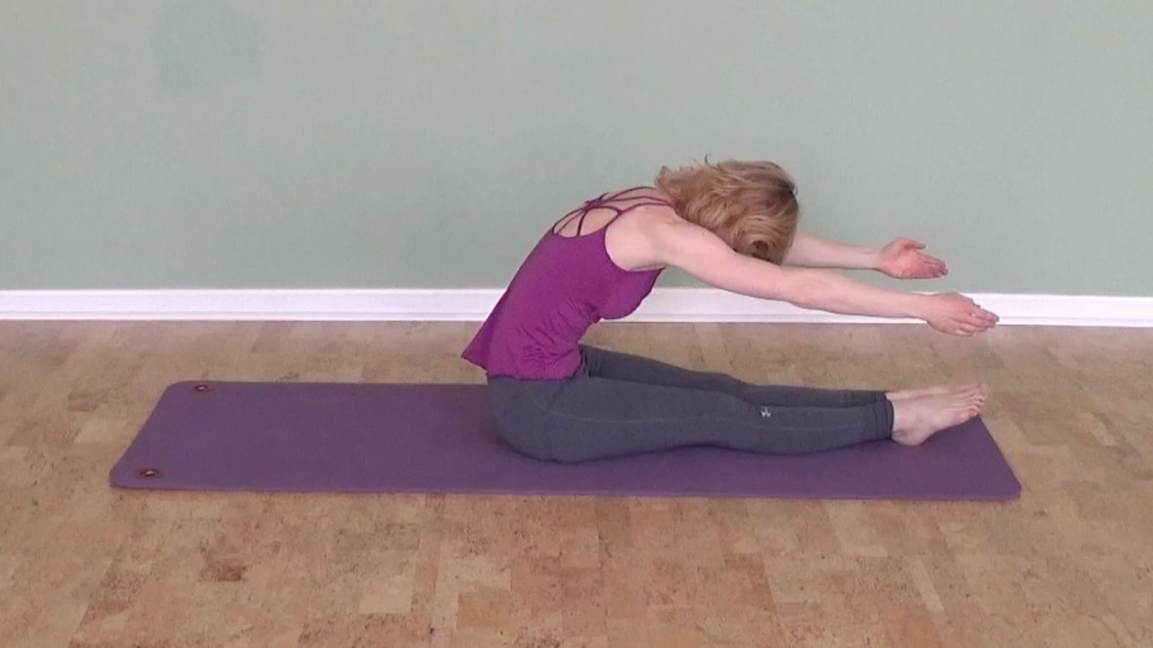 How do I help someone who struggles with the Pilates roll up