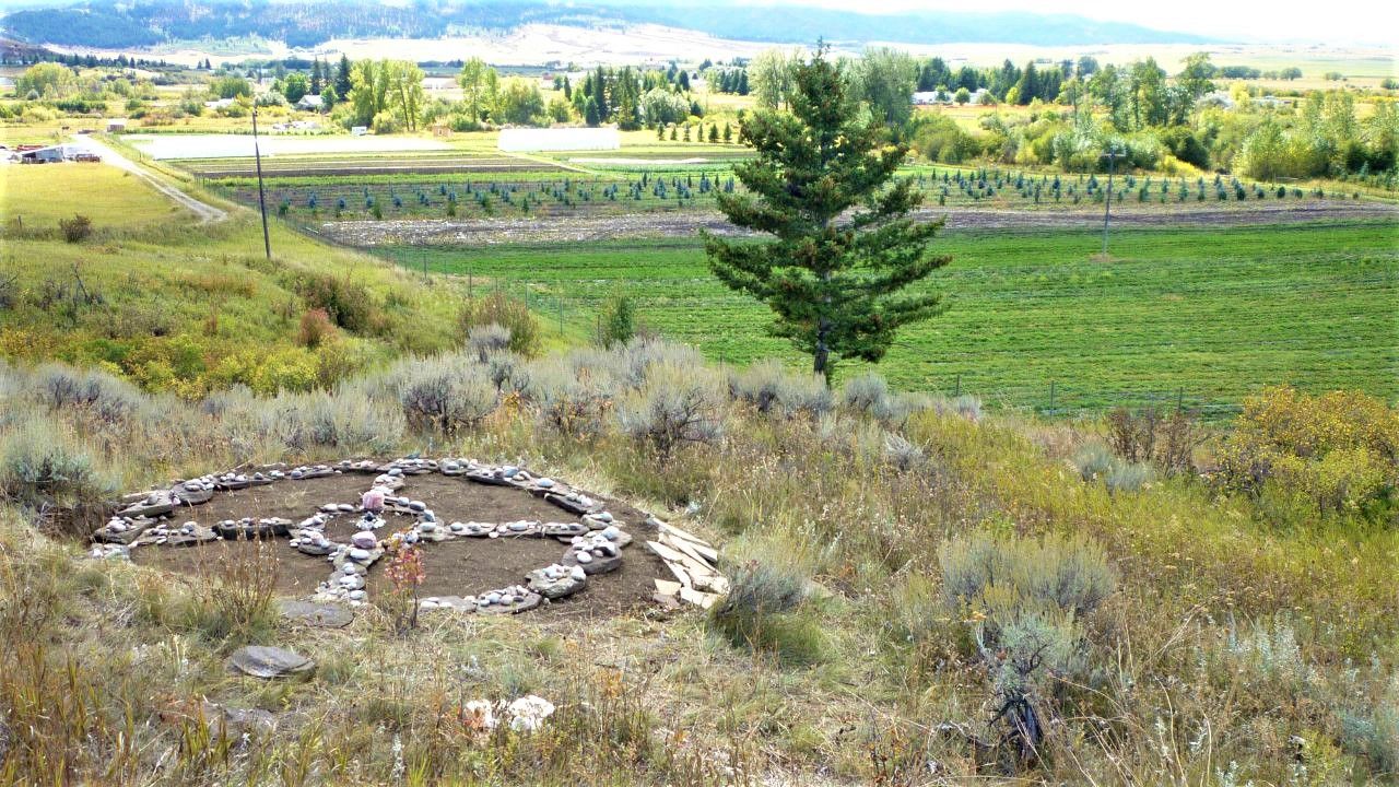 Medicine wheel on hillside with a wide view of the Gallatin "Valley of Flowers"