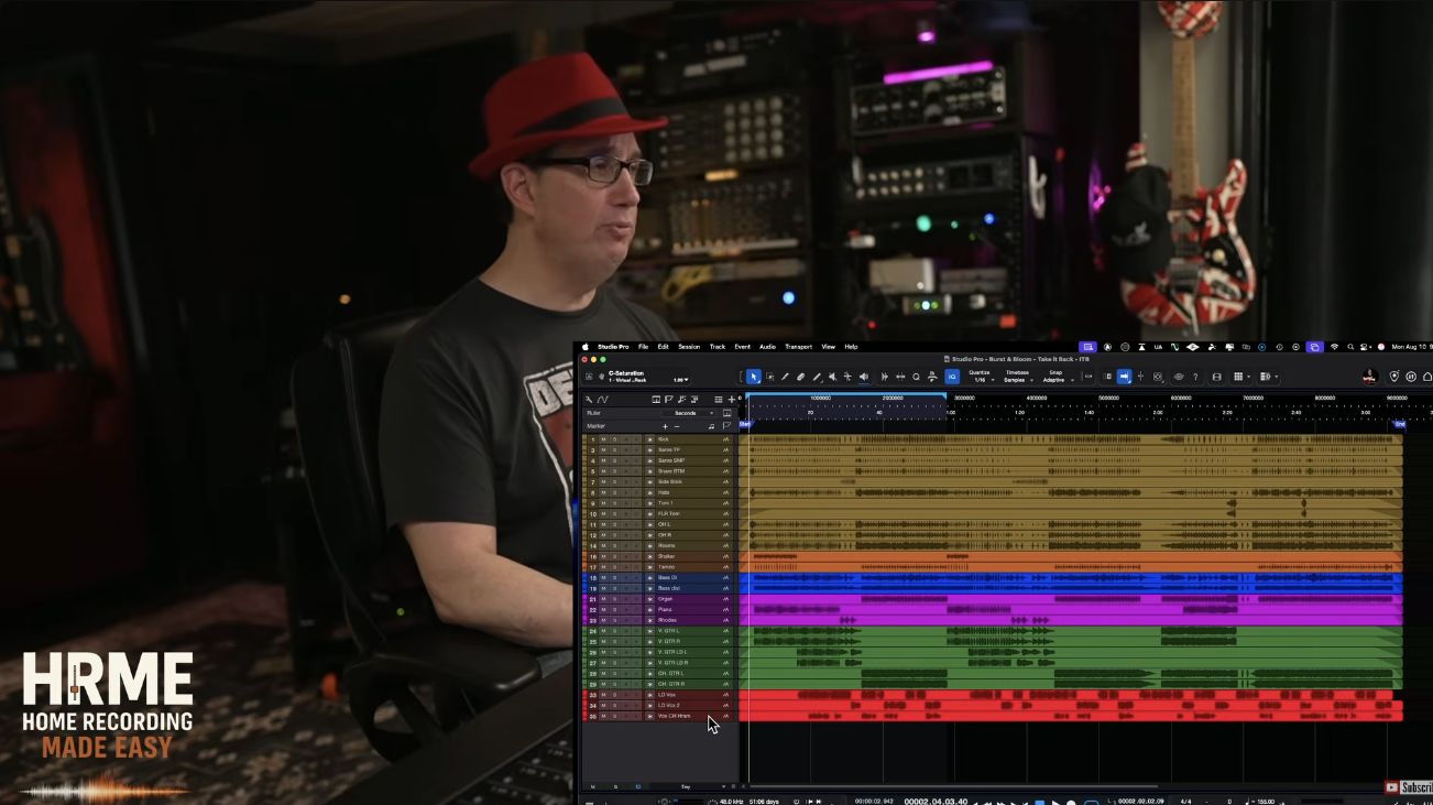 David beside a DAW arrangement with named audio tracks organized into colored instrument groups.