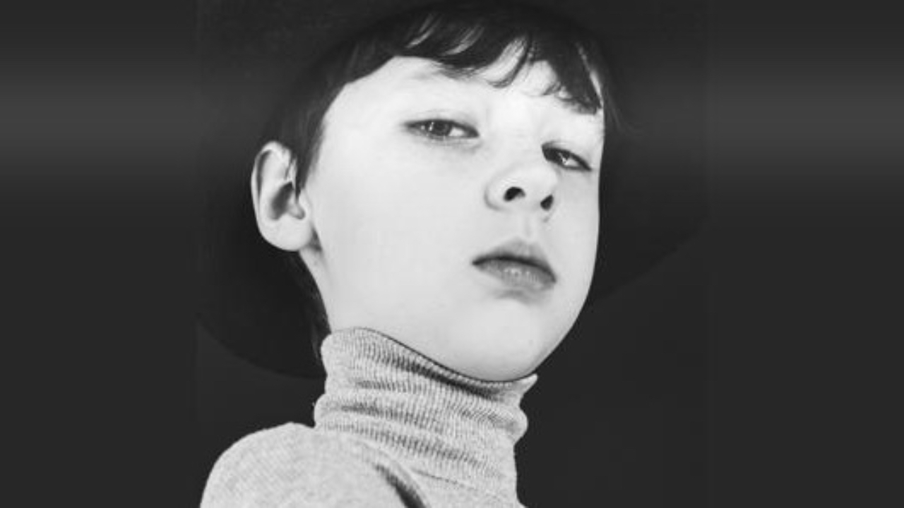 Boy titling at the top joint as he looks down