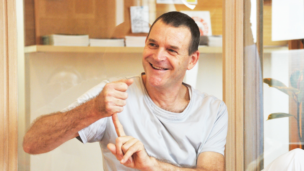 Jeremy showing AT hand symbol