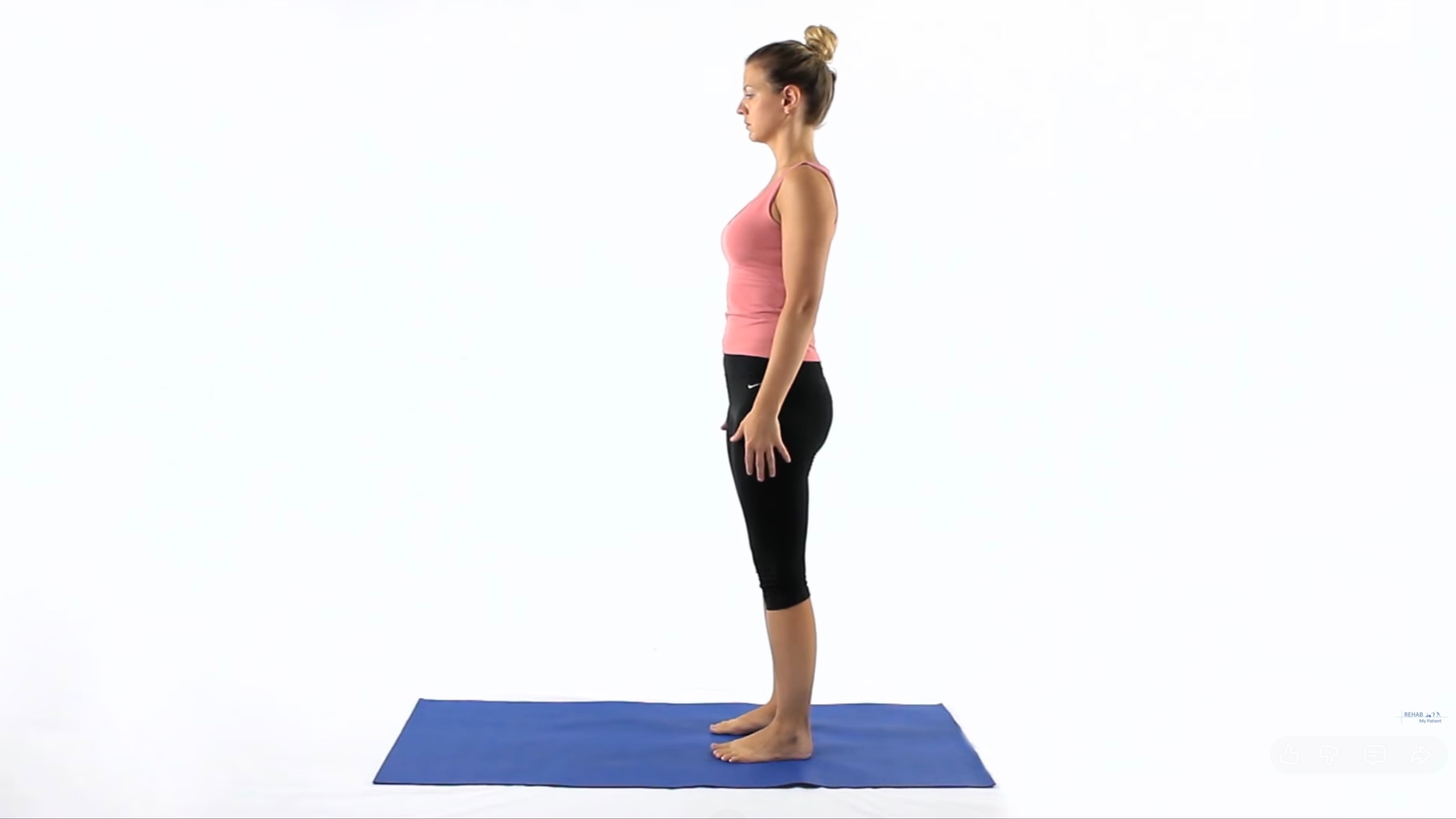 Woman standing about to do roll down