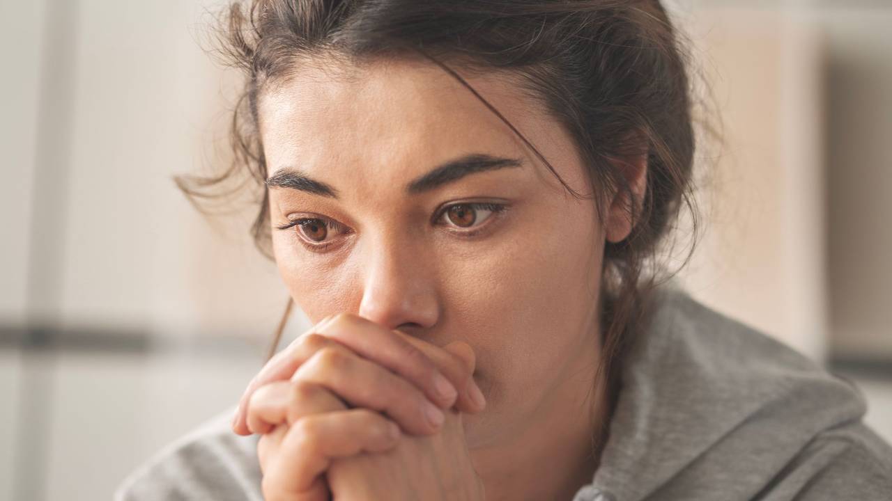 woman struggling with betrayal trauma