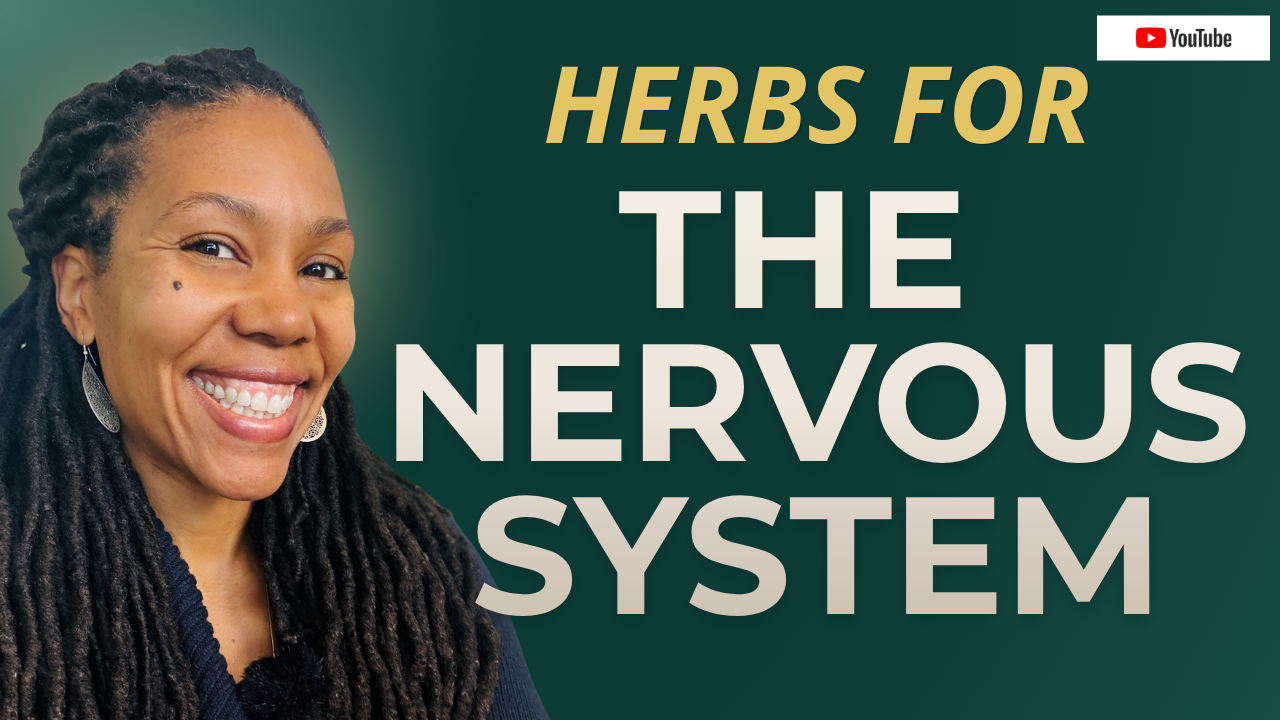 black woman smiling with locs