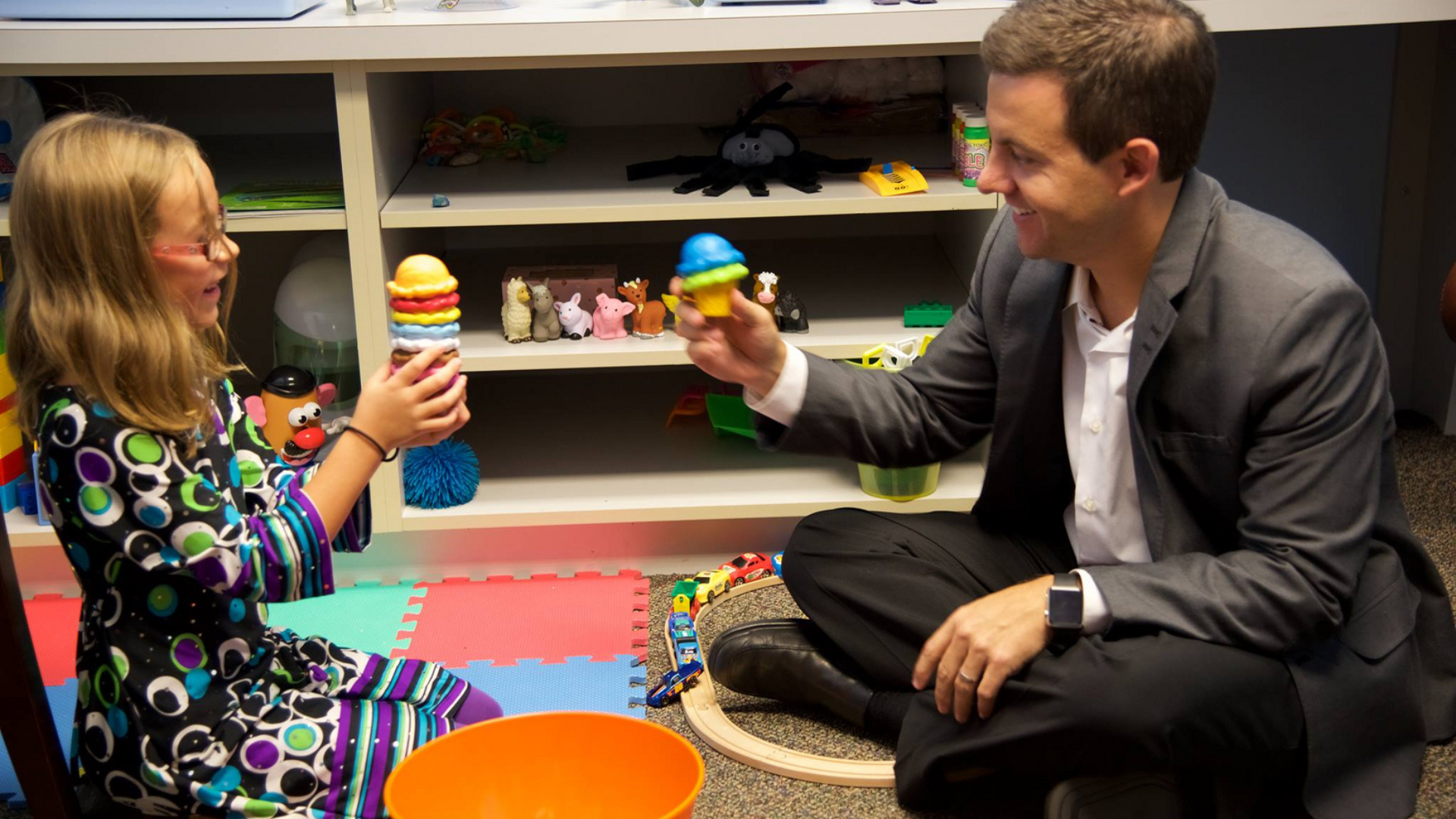 Dr. Mark Bowers playing with a child
