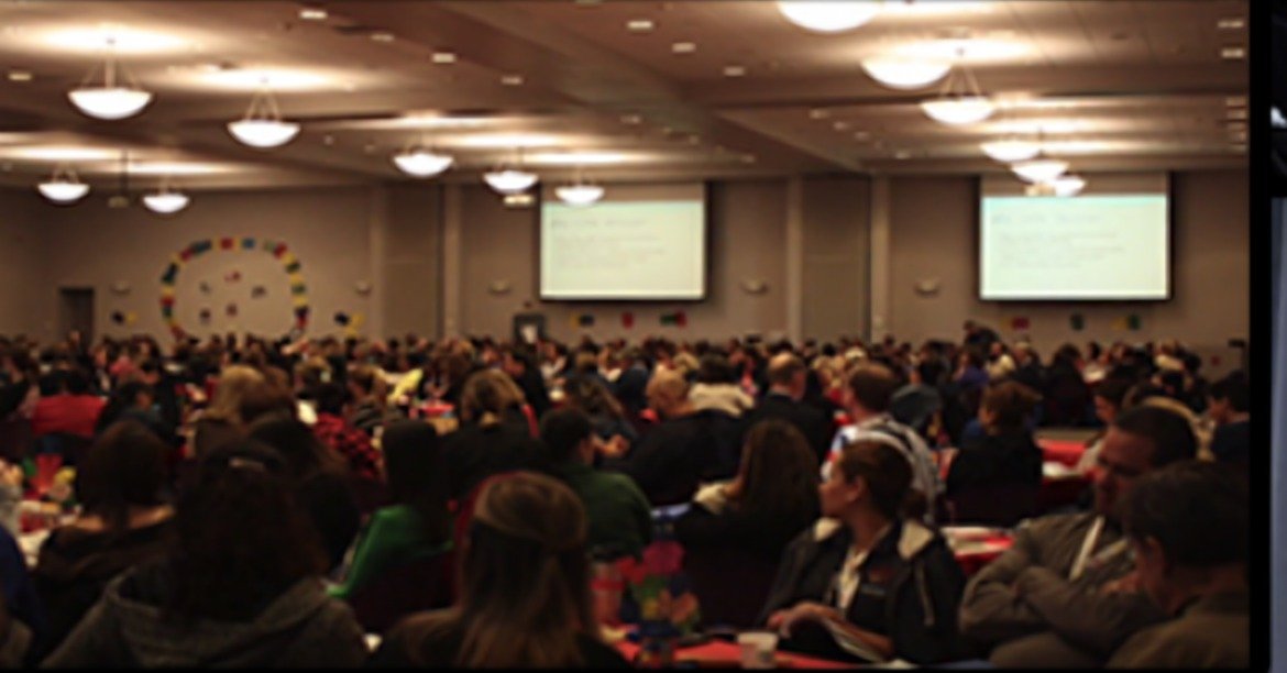 A packed ballroom audience at one of Tyler McNamer's talks