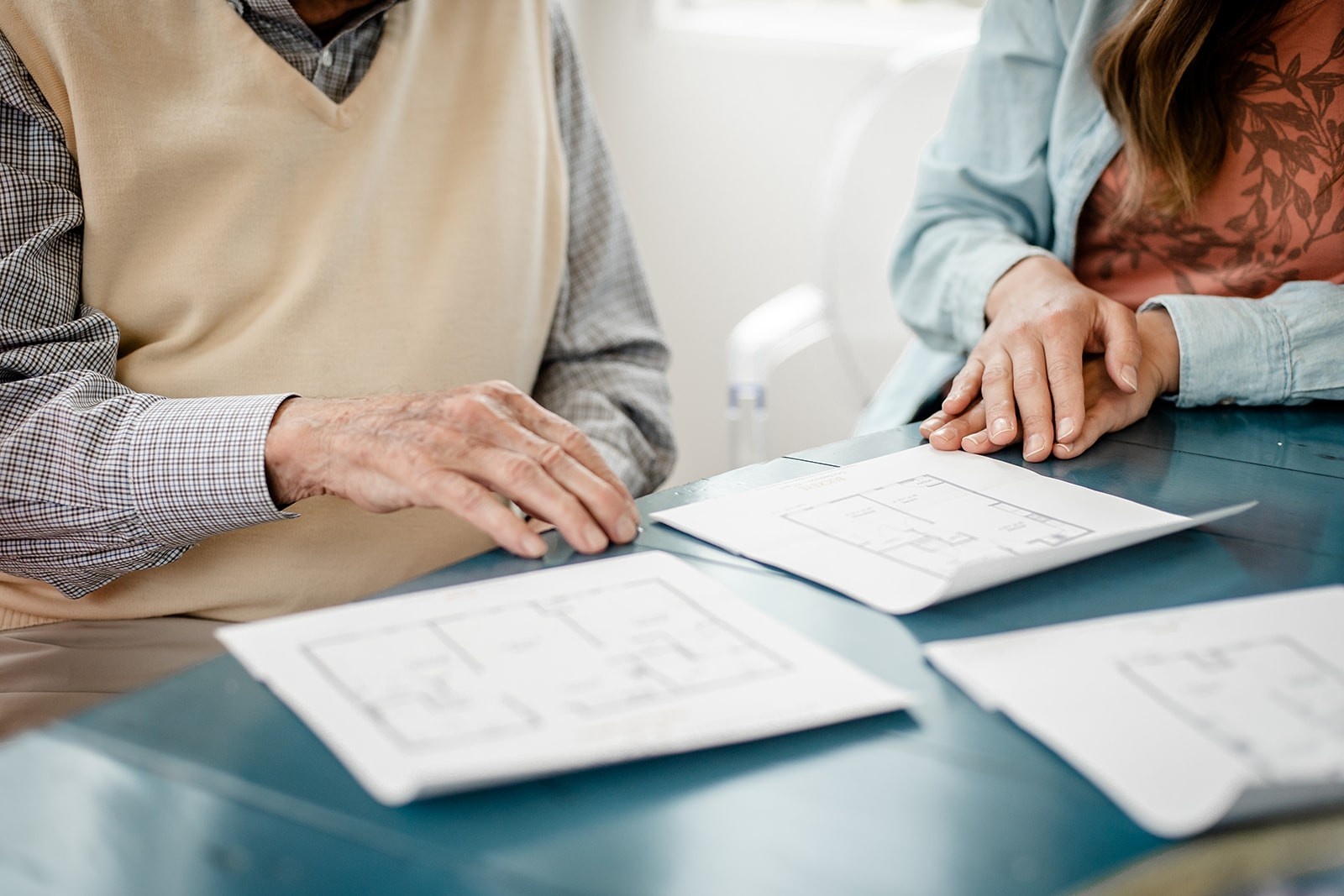 Songbird reviewing space plans for senior living community apartment